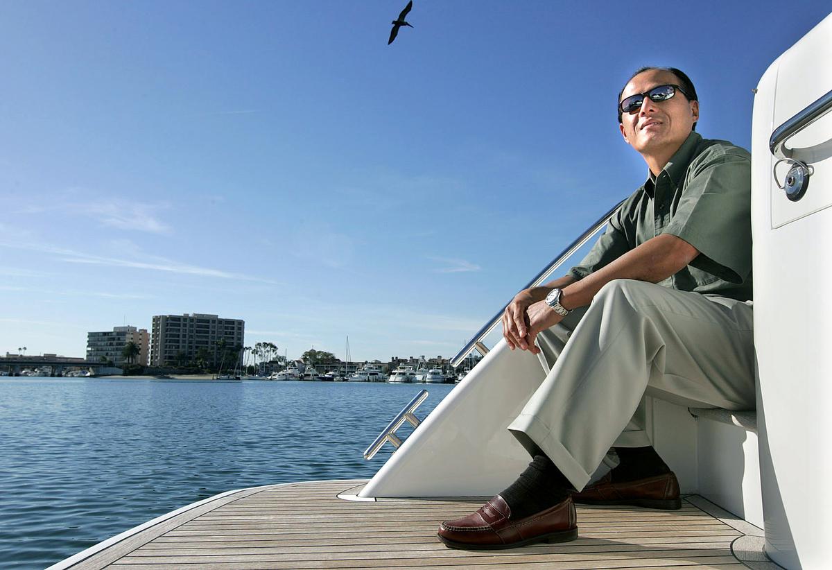 A WARM SUNNY DAY: Anthony Hsieh, owner of Crow's Nest Yacht Sales in Newport Beach, is photographed on a Viking 50 Sport Cruiser.


///Additional Information///:
hsieh.read.ch. photo taken 1/15/08 by Christina House / For The Orange County Register
Anthony Hsieh, owner of Crow's Nest Yacht Sales in Newport Beach, is photographed on a Viking 50 Sport Cruiser.