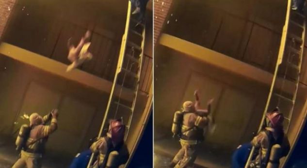 VIDEO/ Pallati në flakë, prindi hedh fëmijën nga ballkoni, e pret zjarrfikësi
