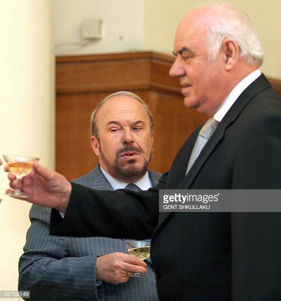 TIRANA, ALBANIA:  Albanian Prime Minister Fatos Nano (L) of the ruling Socialist Party toast with President Alfred Moisiu (R), after signing a Code of Conduct where 16 political parties pledged to hold free and democratic elections next July, 27 April 2005 in Tirana. The code was initiated by President Alfred Moisiu, who set July 3 as Albania's election date, rejecting an opposition demand for an earlier ballot. AFP PFOTO / GENT SHKULLAKU   (Photo credit should read GENT SHKULLAKU/AFP/Getty Images)