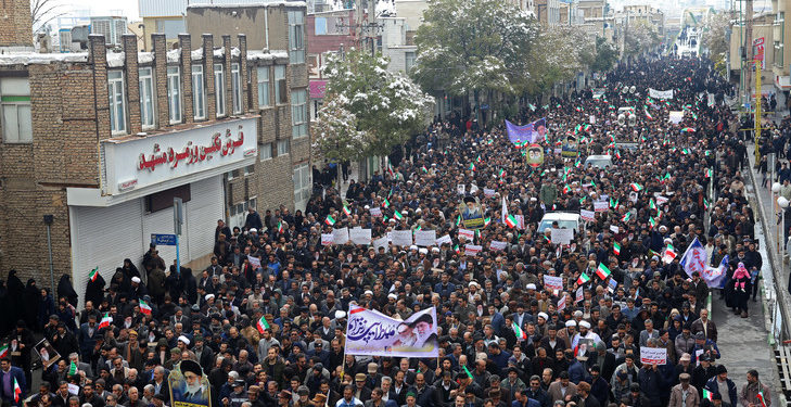 Iranian men during Supporters of the government and  Iran's Supreme Leader Ayatollah Ali Khamenei at the demonstration in Arak on November 20, 2019 .