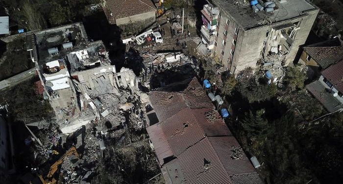 Rescuers search at a damaged building after a magnitude 6.4 earthquake in Thumane, western Albania, Tuesday, Nov. 26, 2019. Rescue crews used excavators to search for survivors trapped in toppled apartment buildings Tuesday after a powerful pre-dawn earthquake in Albania killed at least 14 people and injured more than 600. (ANSA/AP Photo/Hektor Pustina) [CopyrightNotice: Copyright 2019 The Associated Press. All rights reserved]