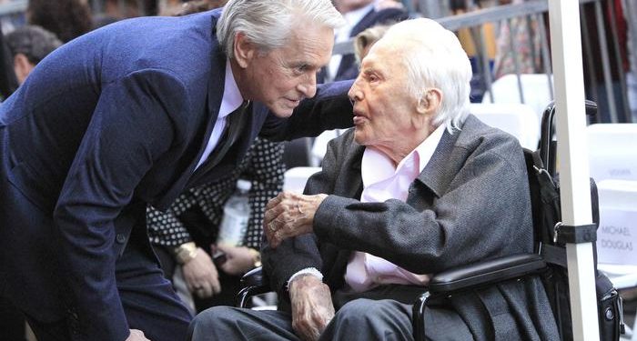 epa07147001 US actor Michael Douglas (L) talks to his father, actor Kirk Douglas during a ceremony honoring him with a star on the Hollywood Walk of Fame in Hollywood, California, USA, 06 November 2018. Douglas received the 2,648th star in the Motion Pictures category.  EPA/NINA PROMMER