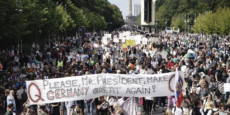 Protestors hold a banner reading "Please, Mr. President, Make Germany Great Again!" during demonstrations against the coronavirus measures by the German Government in Berlin, Germany, on Aug. 29, 2020.