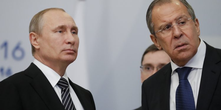 Russian President Vladimir Putin, left, and Foreign Minister Sergey Lavrov attend the ASEAN  Russia summit in the Black Sea resort of Sochi, Russia, Thursday, May 19, 2016. (AP Photo/Alexander Zemlianichenko, pool)