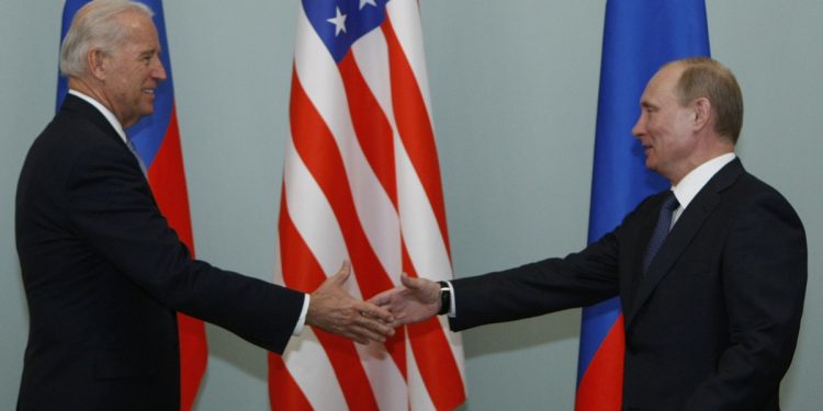 Vice President of the United States Joe Biden, left, shakes hands with Russian Prime Minister Vladimir Putin in Moscow,  Russia, Thursday, March 10, 2011.The talks in Moscow are expected to focus on missile defense cooperation and Russia's efforts to join the World Trade Organization. (AP Photo/Alexander Zemlianichenko)