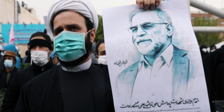 A protester holds a picture of Mohsen Fakhrizadeh, Iran's top nuclear scientist, during a demonstration against his killing in Tehran, Iran, November 28, 2020. Majid Asgaripour/WANA (West Asia News Agency) via REUTERS ATTENTION EDITORS - THIS IMAGE HAS BEEN SUPPLIED BY A THIRD PARTY.