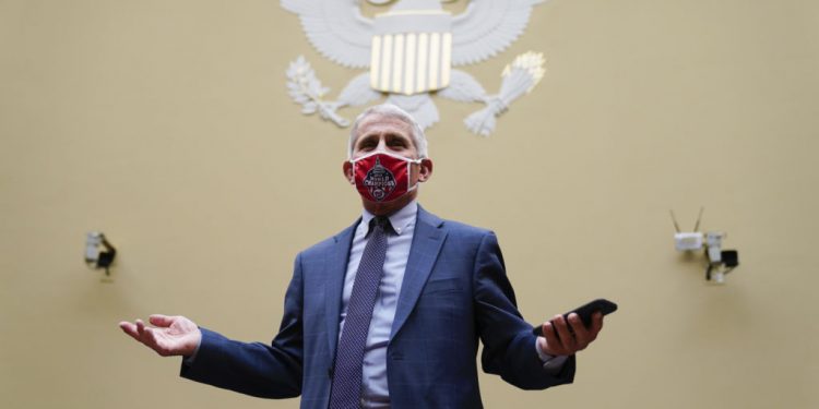 Dr. Anthony Fauci, director of the National Institute for Allergy and Infectious Diseases, arrives to a House Select Subcommittee hearing on the Coronavirus, Friday, July 31, 2020 on Capitol Hill in Washington.  (Erin Scott/Pool via AP)