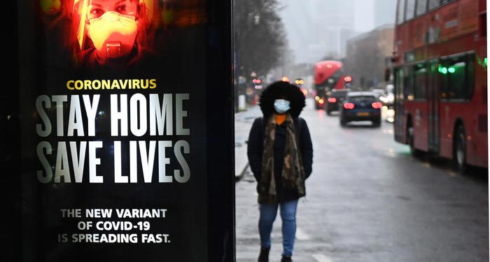 epa08934731 A public health notice to 'stay home' at a bus stop in London, Britain, 13 January 2021. Britain's national health service (NHS) is coming under sever pressure as Covid-19 hospital admissions continue to rise across the UK.  EPA/ANDY RAIN