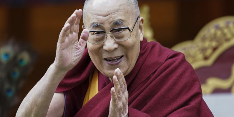 FILE - In this April 5, 2017, file photo, Tibetan spiritual leader the Dalai Lama greets devotees at the Buddha Park in Bomdila, Arunachal Pradesh, India. More than 150 Tibetan religious leaders say their spiritual leader, the Dalai Lama, should have the sole authority to choose his successor. A resolution adopted by the leaders at a conference on Wednesday, Nov. 27, 2019, says the Tibetan people will not recognize a candidate chosen by the Chinese government for political ends. ( AP Photo/Tenzin Choejor, File)