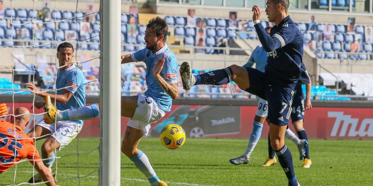 ROME, ITALY - NOVEMBER 08: Cristiano Ronaldo of Juventus scores a goal during the Serie A match between SS Lazio and Juventus at Stadio Olimpico on November 08, 2020 in Rome, Italy. (Photo by Giampiero Sposito/Getty Images)