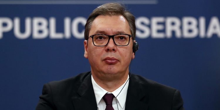 Serbian President Aleksandar Vucic listens Turkey's President Recep Tayyip Erdogan during a joint news conference in Belgrade, Serbia, Monday, Oct. 7, 2019. Turkish President Recep Tayyip Erdogan said Monday in Belgrade that Turkey will continue to play a "constructive role" in boosting stability in the Balkans where it maintains historic influence stemming from the centuries-long Ottoman rule. (AP Photo/Darko Vojinovic)