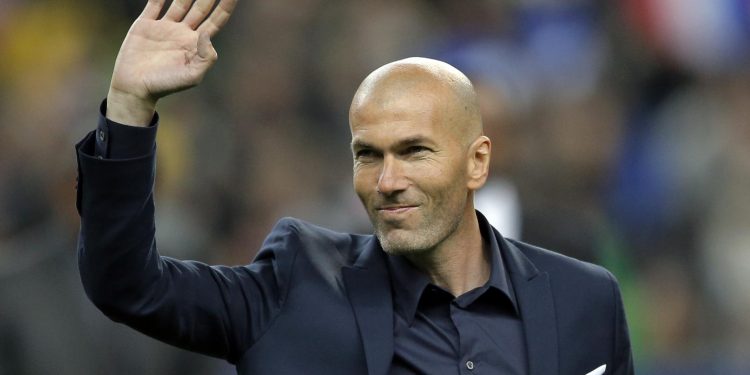 FILE - In this March 26, 2015 file photo, former soccer player and current Real Madrid B team coach Zinedine Zidane waves to spectators prior to the international friendly soccer match between France and Brazil at the Stade de France, north of Paris, France. Real Madrids President Florentino Perez announced Monday Jan. 4, 2016 that current coach Rafael Benitez has been fired and former player and Real Madrids B team coach Zinedine Zidane will take over. Benitez, hired seven months ago, has been under pressure since a demoralising 4-0 home loss to Barcelona in November. The team won seven of nine matches since the defeat at the Bernabeu, but fans continued to call for Benitez's departure. (AP Photo/Francois Mori, File) ORG XMIT: PW104