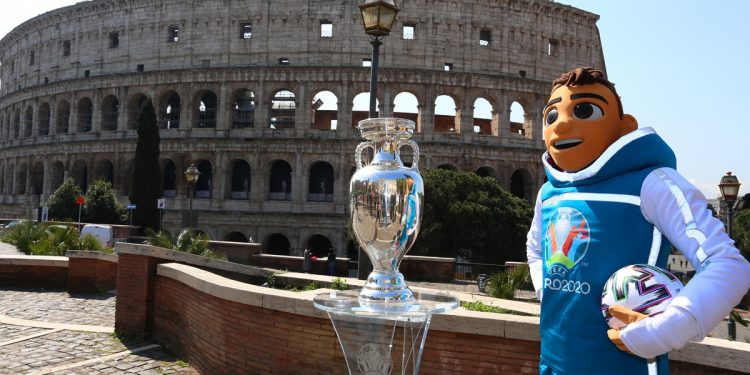 ROME, ITALY - APRIL 20:  The Mascotte Skillzy poses with the trophy in front of the Colosseum during the UEFA Euro 2020 Trophy Tour of Rome on April 20, 2021 in Rome, Italy.  (Photo by Paolo Bruno/Getty Images)