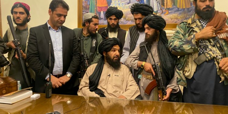 Taliban fighters take control of Afghan presidential palace after the Afghan President Ashraf Ghani fled the country, in Kabul, Afghanistan, Sunday, Aug. 15, 2021. (AP Photo/Zabi Karimi)