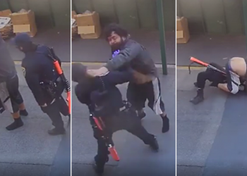 VIDEO/ Efektivja e policisë dhunohet nga një i pastrehë, kalimtarët e shpëtojnë nga vdekja