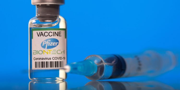 FILE PHOTO: A vial labelled with the Pfizer-BioNTech coronavirus disease (COVID-19) vaccine is seen in this illustration picture taken March 19, 2021. REUTERS/Dado Ruvic/Illustration/File Photo