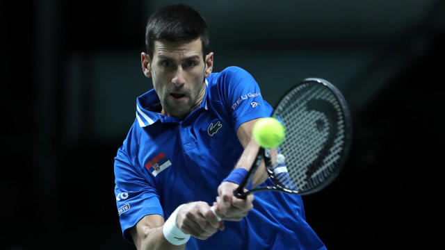 MADRID, SPAIN - DECEMBER 03: Novak Djokovic of Serbia plays a backhand against Marin Cilic of Croatia during the Davis Cup Semi Final match between Croatia and Serbia at Madrid Arena on December 03, 2021 in Madrid, Spain. (Photo by Sanjin Strukic/Pixsell/MB Media/Getty Images)