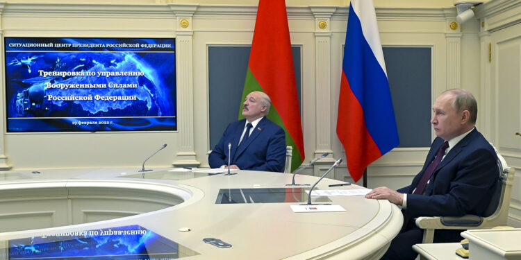 Russian President Vladimir Putin, right, and Belarusian President Alexander Lukashenko watch military drills via videoconference in Moscow, Russia, Saturday, Feb. 19, 2022. The Russian military on Friday announced massive drills of its strategic nuclear forces. Russian President Vladimir Putin will personally oversee Saturday's exercise, which will involve multiple practice launches of intercontinental ballistic missiles and cruise missiles, the Defense Ministry said. (Alexei Nikolsky, Sputnik, Kremlin Pool Photo via AP)