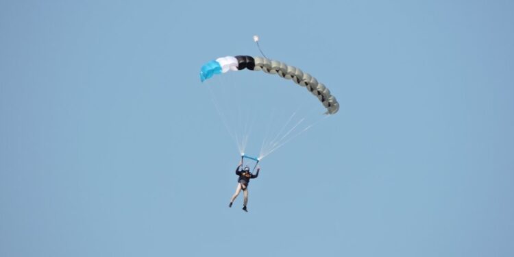 U.S. Air Force Senior Airman Anish Chauhan, a water and fuels systems management journeyman assigned to the 509th Civil Engineer Squadron, guides his parachute during a skydiving jump July 15, 2017, over Kansas City, Mo. Chauhan has been skydiving since 2012 and is working toward becoming a skydiving instructor, he currently has jumped 35 times and needs a minimum of 200 jumps to become an instructor. (courtesy photo)