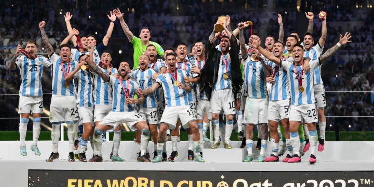 LUSAIL CITY, QATAR - DECEMBER 18: Lionel Messi of Argentina lifts the FIFA World Cup Qatar 2022 Winner's Trophy during the FIFA World Cup Qatar 2022 Final match between Argentina and France at Lusail Stadium on December 18, 2022 in Lusail City, Qatar. (Photo by Dan Mullan/Getty Images)