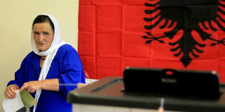 epa06049426 An elderly Albania woman looks at the ballot box before casting her vote at a polling station in Tirana, Albania, 25 June 2017.  Albanians head to the polls on 25 June for parliamentary elections.  EPA/MALTON DIBRA