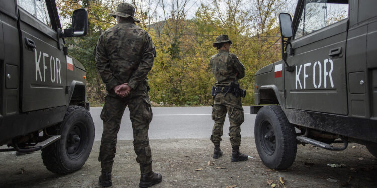 ZVECAN, KOSOVO - October 12: NATO led soldiers from the Republic of Poland patrol at a crossroad near northern Kosovo town of Zvecan on October 12, 2022 in Zvecan, Kosovo. The NATO KFOR mission, active in Kosovo since 1999 to foster security and stability, has sent in new troops amid fears of unrest between minority Serbs and Kosovars. (Photo by Ferdi Limani/Getty Images)