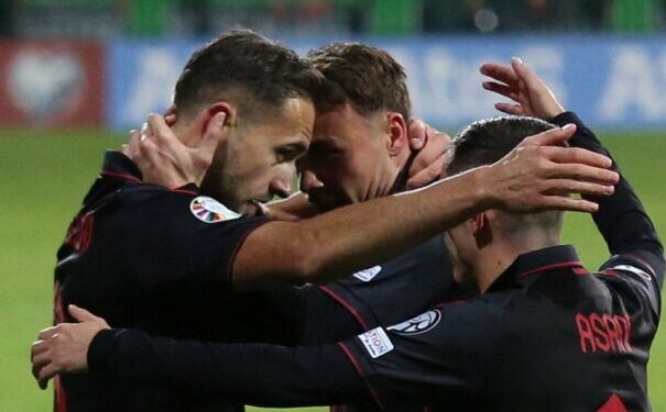 Albania's forward Sokol Cikalleshi (L) celebrates with teammates after he scored his team's first goal during the UEFA Euro 2024 Group E qualifying football match between Moldova and Albania in Chisinau on November 17, 2023. (Photo by Elena COVALENCO / AFP) (Photo by ELENA COVALENCO/AFP via Getty Images)