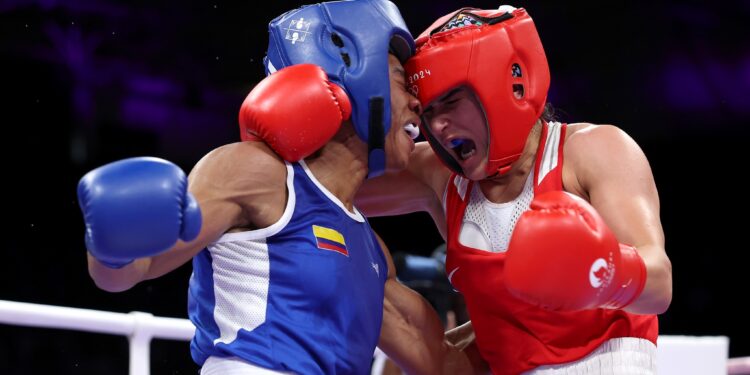 PARIS, FRANCE - JULY 29: Angie Paola Valdes Pana of Team Colombia and Donjeta Sadiku of Team Kosovo exchange punches during the Women's 60kg preliminary round match between Donjeta Sadiku of Team Kosovo and Angie Paola Valdes Pana of Team Colombia on day three of the Olympic Games Paris 2024 at North Paris Arena on July 29, 2024 in Paris, France. (Photo by Richard Pelham/Getty Images)