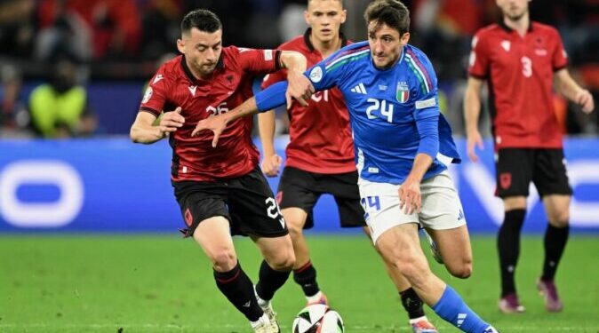 Albania's forward #26 Arber Hoxha fights for the ball with Italy's defender #24 Andrea Cambiaso during the UEFA Euro 2024 Group B football match between Italy and Albania at the BVB Stadion in Dortmund on June 15, 2024. (Photo by INA FASSBENDER / AFP)