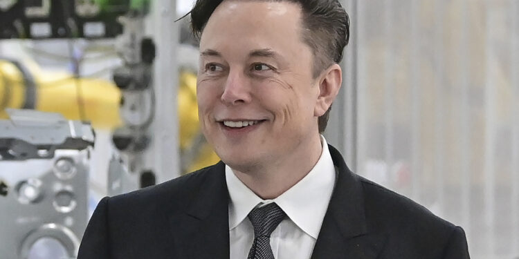 FILE - Tesla CEO Elon Musk attends the opening of the Tesla factory Berlin Brandenburg in Gruenheide, Germany, March 22, 2022. Twitter shareholders have filed a lawsuit accusing Musk of engaged in “unlawful conduct” aimed at sowing doubt about his bid to buy the social media company. The lawsuit filed late Wednesday, May 25, in the U.S. District Court for the Northern District of California claims the billionaire Tesla CEO has sought to drive down Twitter’s stock price because he wants to walk away from the deal or negotiate a substantially lower purchase price. (Patrick Pleul/Pool Photo via AP, File)