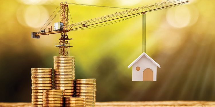 Stacking gold coins with increase and tower crane and hoist brake solutions with build new house in the public park, saving money and loan for construction real estate and home concept.