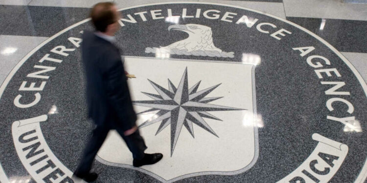 A group of 3,000 ordinary citizens, armed with nothing more than an Internet connection, is often making better forecasts of global events than CIA analysts. Here, a man crosses the CIA logo at its headquarters in Langley, Va.