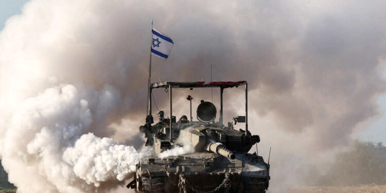TOPSHOT - An Israeli army tank rolls in southern Israel along the border with the Gaza Strip on January 24, 2024, amid ongoing battles between Israel and the Palestinian militant group Hamas. (Photo by JACK GUEZ / AFP) (Photo by JACK GUEZ/AFP via Getty Images)